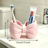 Estante de escritorio con forma de lazo para guardar cepillos de dientes, organizador para lavabo, portacepillos de dientes y pasta de dientes, caja de almacenamiento