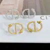 Pendientes de botón CD con letra en forma de dragón con microincrustaciones de circonita, aguja de plata s925, pendientes exquisitos, lujo ligero, sensación de alta calidad, pendientes del año de nacimiento