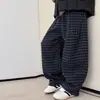 Pantalones de Otoño e Invierno para Niños con Forro Polar 2026 Nuevo Estilo Niños Grandes Invierno Casual Integrado Forro Polar Niños Engrosados Cuadros Pantalones Largos