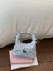 Bolsas de Nicho Super Populares para Primavera e Verão para Mulheres 2026 Nova Moda Versátil Bolsa de Ombro Transversal Bolsa de Mão Pequena Exquisita