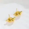 Celi viento lujo ligero pendientes compactos anudados moda retro pendientes de acero de titanio no se decoloran fábrica joyería para niñas al por mayor