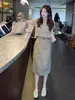 Falda de diseño con abertura estilo retro para mujer, nuevo modelo primavera-verano 2026, de cintura alta, estiliza la figura, falda midi súper elegante y versátil
