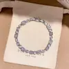 [Cadena de Diamantes Arcoíris] Pulsera de extracción de zircón trenzado en cruz, una pulsera lujosa y de alta gama, una pieza de joyería delicada y de moda