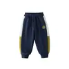 WALNUT DUCK Ropa Infantil 2026 Otoño Nuevo Estilo Pantalones Deportivos de Patchwork de Moda Sencilla para Niños Pantalones Largos de Punto