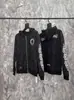24 Chaquetas Nuevas con Capucha y Cremallera Patrón Oscuro Chaqueta Estampada Cruzada para Hombres y Mujeres Parejas