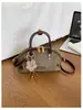 Bolso de Temperamento para Mujer 2026 Verano Nueva Moda Simple Color Sólido Bolso Cruzado para Mujer Bolso Pequeño de Dumpling de Nicho