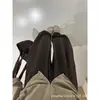 Pantalones anchos color marrón melardo para mujer, nueva colección otoño 2026, corte holgado, estilo boyfriend, cintura alta, adecuados para figuras petite, con detalles de pliegues