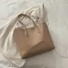 Bolsa de Grande Capacidade para Mulheres 2026 Primavera Novo Estilo Bolsa de Ombro Simples Popular Este Ano para Trabalho e Deslocamento Bolsa Tote de Cor Sólida