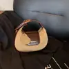 Bolso de mano pequeño redondo para mujer, colección otoño/invierno 2025, bolso de hombro moderno y a la moda, bolso tote simple y versátil