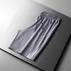 Pantalones cortos deportivos de seda helada para hombre de talla grande de verano, pantalones finos de secado rápido hasta la rodilla, pantalones holgados y transpirables para correr y fitness, modernos