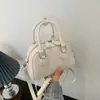 Bolsa de ombro estilosa estilo coreano para mulheres, nova moda primavera 2026, bolsa de ombro casual para trabalho e deslocamento, bolsa baguette para mulheres