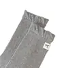 Etiqueta de tela de gatito en el talón, calcetines de media pantorrilla estilo ins coreano, calcetines holgados de color sólido de dibujos animados, calcetines de algodón para mujer sin costuras de otoño e invierno