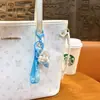 Llavero creativo de concha pequeña con aceite, lindo colgante pequeño de arena movediza líquida, accesorios para bolso, pequeño colgante de regalo, venta al por mayor