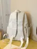 Mochila azul marino de estilo americano con color de contraste, estilo universitario fresco, adecuada para estudiantes, versátil para ir al trabajo y uso casual.