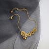 Tornozeleira de sino em aço titânio simples personalizada europeia e americana feminina moda banhada a ouro rosa 18K moeda de cobre celebridade da internet estilo frio joia