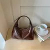 Bolso liso de color para axila estilo perezoso 2026 verano nuevo bolso tipo empanada alta para el trabajo y el trayecto bandolera