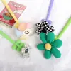 Nueva pluma de gel de flor de tela creativa, linda flor pequeña colorida de silicona de alto valor, pluma de sacudir, pluma a base de agua