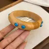 Pulseira Redonda de Pérola Facetada de Madeira Estilo Étnico Retrô Design de Nicho Versátil para o Dia a Dia Joia de Mão Atacado