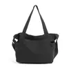 Nova bolsa de lona estilo japonês minimalista 2026, grande capacidade, bolsa de ombro casual, adequada para o trabalho e uso diário, com um design literário e artístico