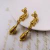 Zhonggu vintage ocidental retro marcação indústria pesada ouro quente ombro flexível escaneamento exagerado brincos 925 prata brincos de agulha