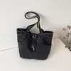 Bolso de axila de diseño retro de nicho transfronterizo para mujer, bolso de mano de lona simple y elegante, bolso de hombro casual y único para el día a día