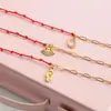 Pulseira Vermelha de Corda com Strass Branco Europeu e Americano Silenciosa Luxo Acessível Aço Inoxidável de Alta Qualidade Joia de Mão Joia Transfronteiriça Design de Nicho