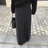 Saia longa de lã preta simples com fenda para mulheres, novo estilo outono e inverno 2026, solta, modeladora, elegante, versátil para mulheres