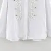 Ins atacado de roupas femininas estilo europeu e americano transfronteiriço outono novo camisa de cor sólida solta decorada com botões de fita trançada estilo Napoleão