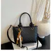 Bolso de mano de nicho transfronterizo, bolso tipo cubo para mujer, nuevo, textura tejida retro, bolso para ir al trabajo, elegante bolso de un solo hombro cruzado