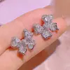 Tiktok live venta caliente collar de cadena de hueso de arco marino pendientes de botón brillantes de diamantes completos anillo traje de joyería venta al por mayor