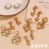 Pendientes de temperamento y personalidad INS de Europa y Estados Unidos, acero inoxidable chapado en oro de 18 quilates, estrella de mar, costura de flor, amor, cesta colgante en espiral