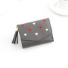 Nueva cartera corta para mujer, estilo coreano, sencillo, estilo europeo y americano, monedero para estudiante con forma de corazón.