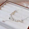 Nuevo collar de perlas hecho a mano con colgante de estrella tridimensional, diseño creativo de nicho, exquisito y delicado, con un toque de alta gama