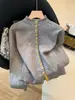 Cárdigan de punto de alta calidad, moderno, único, súper elegante, con bloques de color y cuello alto para mujer, top interior para otoño e invierno de Guangzhou Thirteen Lines