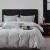 Juego de ropa de cama de cuatro piezas estilo jacquard de lujo ligero de algodón de fibra larga para hombre, funda de edredón de algodón puro negro, sábana bajera, juego de cama de alta gama