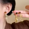 Pendientes Maillard Marrones Otoño e Invierno 2025 para Mujer Estilo Hong Kong Moda Retro Temperamento Pendientes de Piedra Ojo de Tigre Accesorios para Orejas