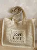 2026 Nuevo Estilo Bolso de Paja Color Sólido Tejido con Letras Personalizadas Bolso de Hombro Tote de Gran Capacidad Casual para Vacaciones Estilo Pastoral