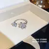 Anel Aberto Flor Zircônia Azul Laço Fresco de Primavera Anel de Dedo Doce de Nicho Joia de Mão com Sensação de Luxo Leve de Alta Qualidade