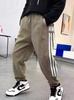 Pantalones de chándal de pana para niño, estilo nuevo Primavera y Otoño 2025 para niños mayores, pantalones largos casuales de algodón cálido con forro polar integrado