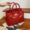 Estilo explosivo de moda transfronteiriça bolsa grande de mão feminina 2026 nova bolsa vermelha de casamento da moda bolsa tote transversal de grande capacidade
