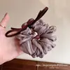 Goma para el pelo de malla con lazo de corazón color marrón claro estilo Dongdaemun coreano, nuevo modelo 2026 con un toque de alta gama para peinados de coleta