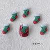 Venta al por mayor Serie navideña adornos para uñas estéreo esmerilado Papá Noel dibujos animados alce muñeco de nieve resina DIY Uñas