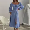 Vestido de Feriado Cruzado Europeu e Americano Outono 2026 Nova Roupa Feminina Dropshipping Casual Francês Ombro a Ombro Saia Longa com Fenda