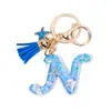 Llavero Colgante Temático Océano Azul con Borla de Estrella de Mar, Llavero de Resina Encanto para Bolso con 26 Letras
