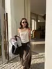 Top Camisola Ajustado Estilo Francés Wanwei para Mujer Primavera 2026 Nuevo Estilo Tirante Fino Borde Enrollado Chaleco de Punto P4065