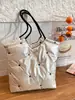 Bolso de Hombro de Gran Capacidad para Mujer 2026 Nuevo Bolso Acolchado con Patrón de Estrellas para Viaje Diario Chaqueta de Plumas Bolso Tote Acolchado Plateado Brillante