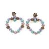 Pendientes exquisitos de moda europea y americana con forma de corazón de pedrería colorida, pendientes creativos geométricos de amor, suministro directo por lotes para comercio electrónico transfronterizo