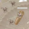 Joyería de uñas nueva de网红 aleación mariposa líquida mariposa plateada estéreo cuadrado de diamante decoración de uñas de diamante al por mayor