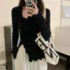Nuevo estilo de top de punto para mujer, otoño e invierno, corte ajustado, diseño irregular, top base de invierno