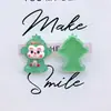 Mono luminoso lindo de dibujos animados diy pegamento de crema tocado pasador joyería regalo creativo accesorios de resina venta al por mayor
